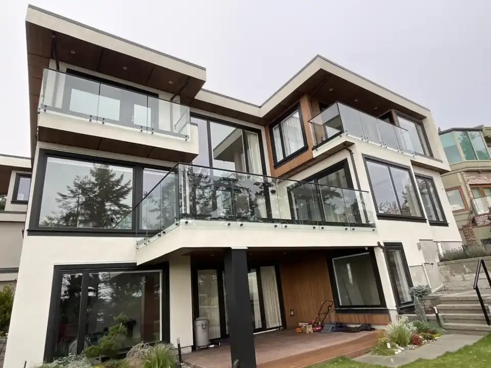 Glass balcony railings on a modern Greater Vancouver home, installed by Alpha Glass Ltd