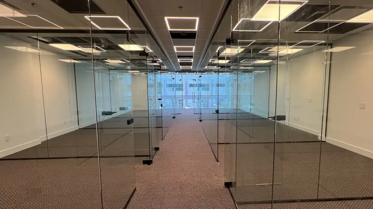 Glass office partitions along a corridor, installed by Alpha Glass Ltd