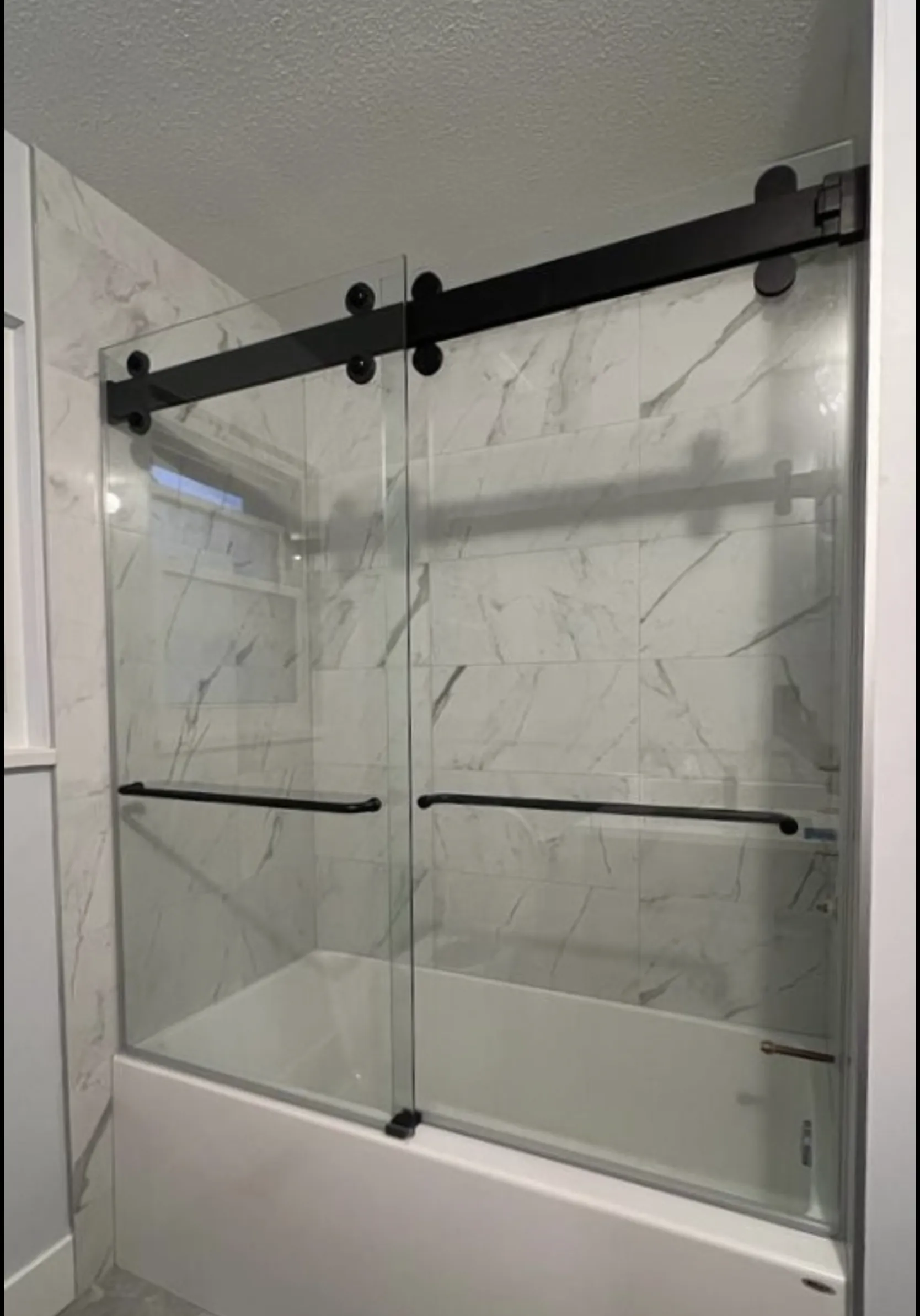Sliding shower doors installed by Alpha Glass Ltd in Greater Vancouver