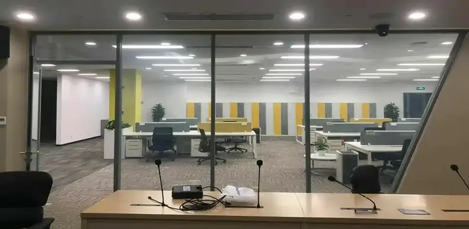 Smart film on an office glass partition switching between clear and opaque